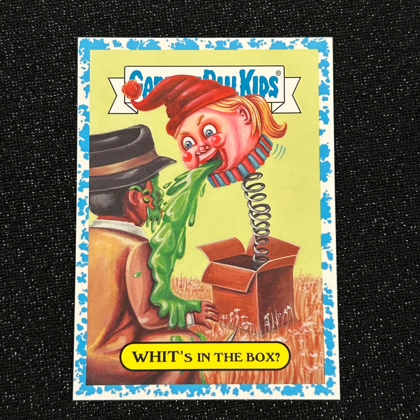 2019 GARBAGE PAIL KIDS WE HATE THE 90's: WHIT'S IN THE BOX? 18a BLUE SPIT 57/99 - NM